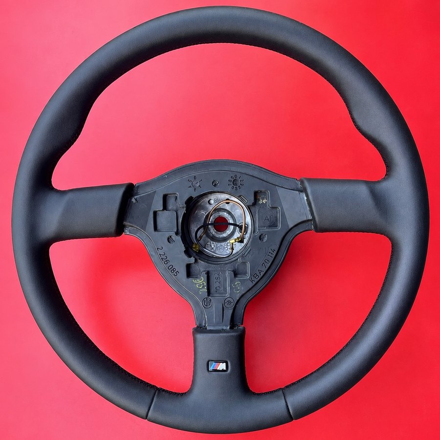 BMW M steering wheel rewrapped in matte black