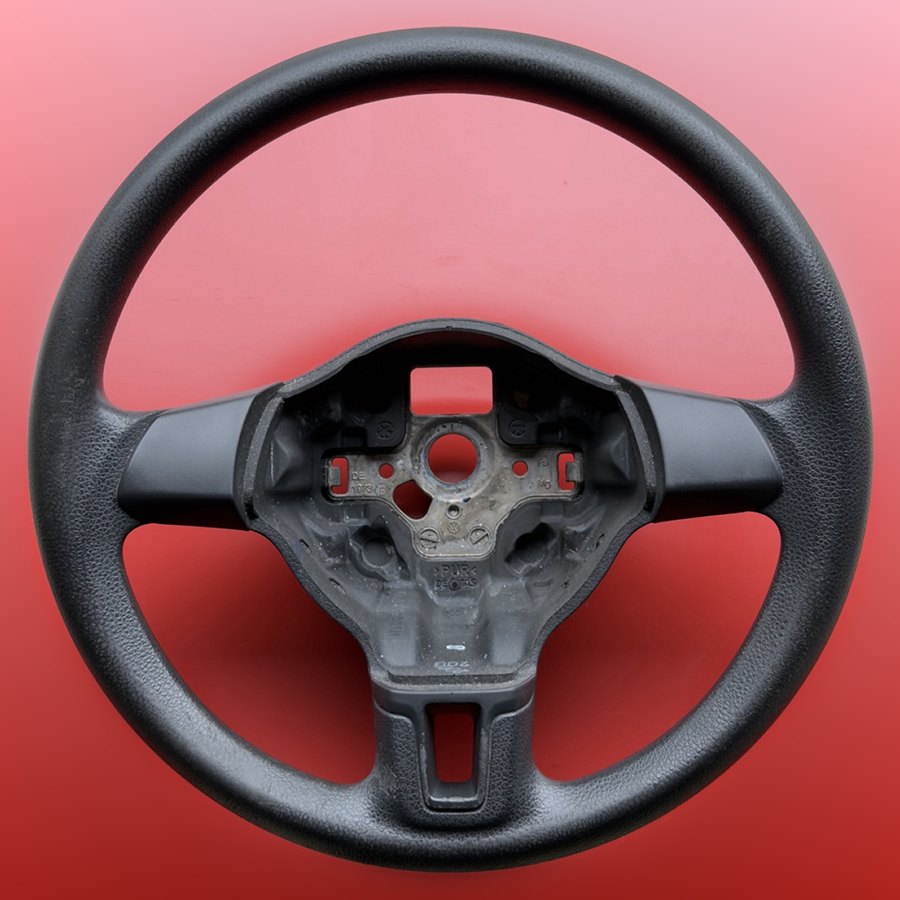 Worn Volkswagen steering wheel before rewrapping